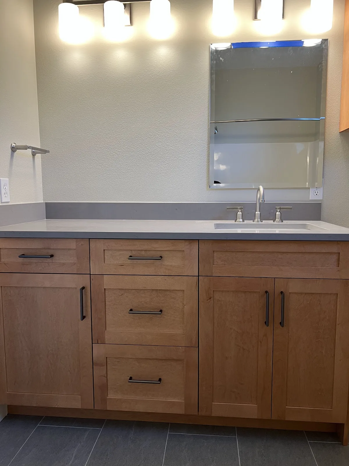 Bathroom with tiled shower, tub surround and a decorative tile niche in Bellingham, WA — Living By Design