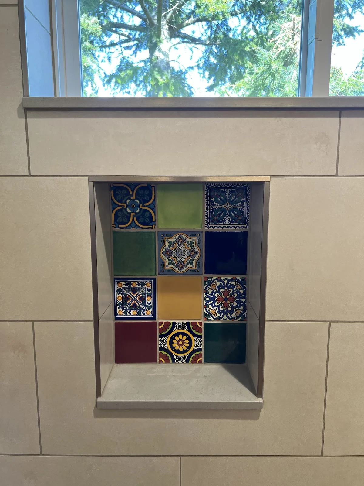 Bathroom with tiled shower, tub surround and a decorative tile niche in Bellingham, WA — Living By Design (4)