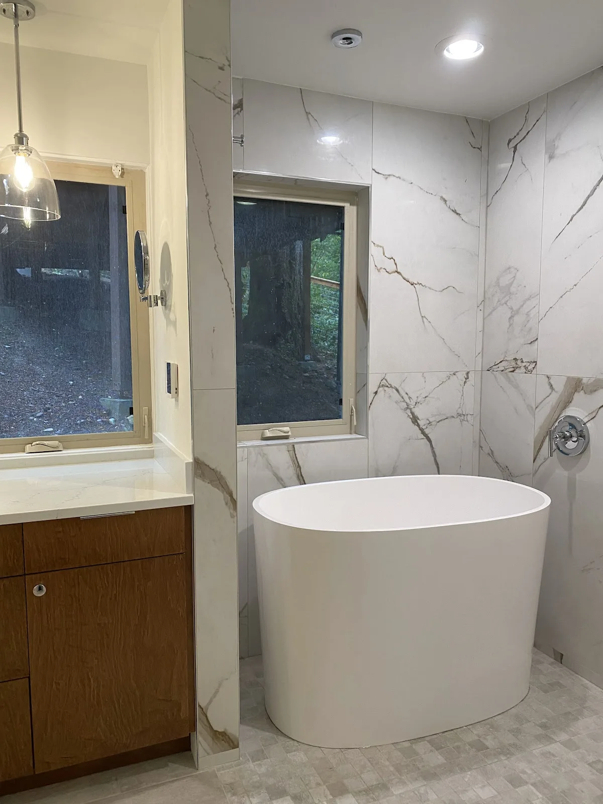 Bellingham bathroom with marble-look porcelain walls, wood vanity and freestanding tub in Bellingham, WA — Living By Design (2)
