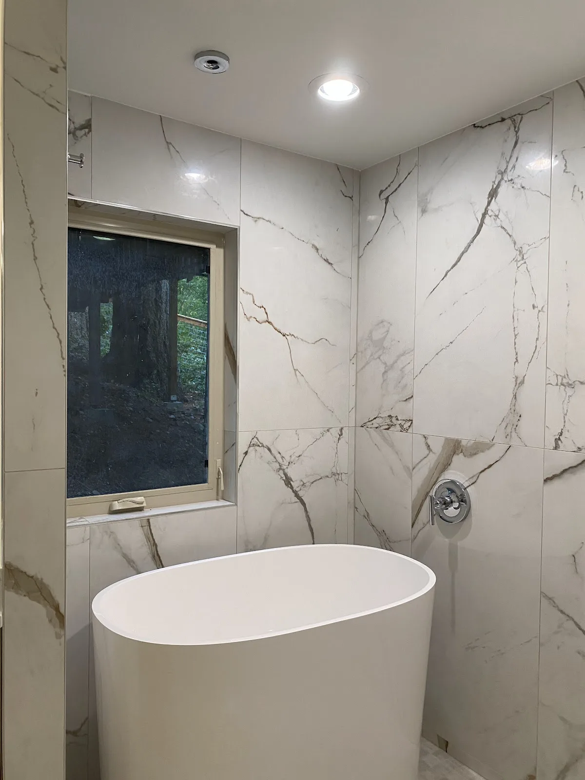 Bellingham bathroom with marble-look porcelain walls, wood vanity and freestanding tub in Bellingham, WA — Living By Design (3)