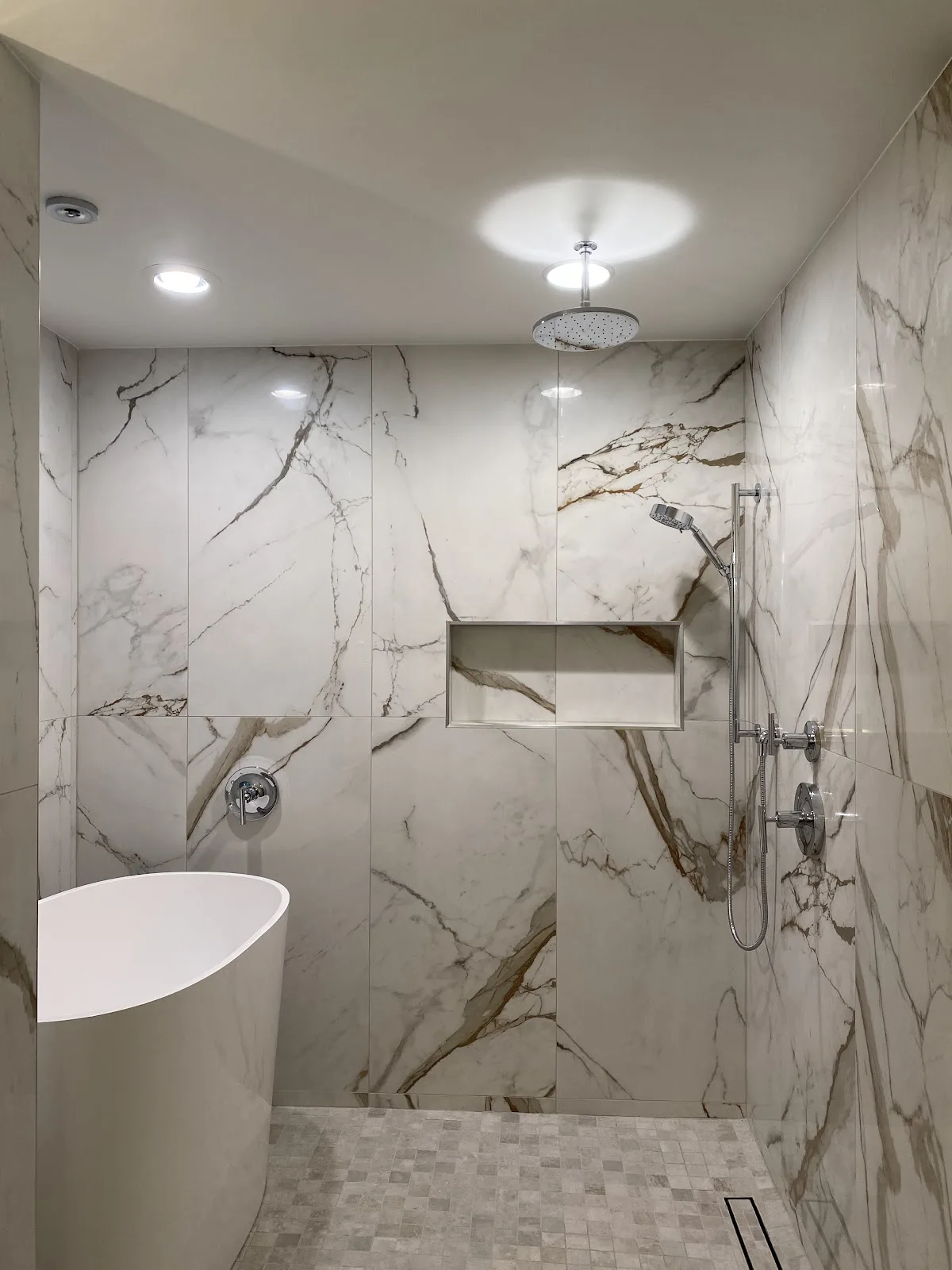 Bellingham bathroom with marble-look porcelain walls, wood vanity and freestanding tub in Bellingham, WA — Living By Design (4)