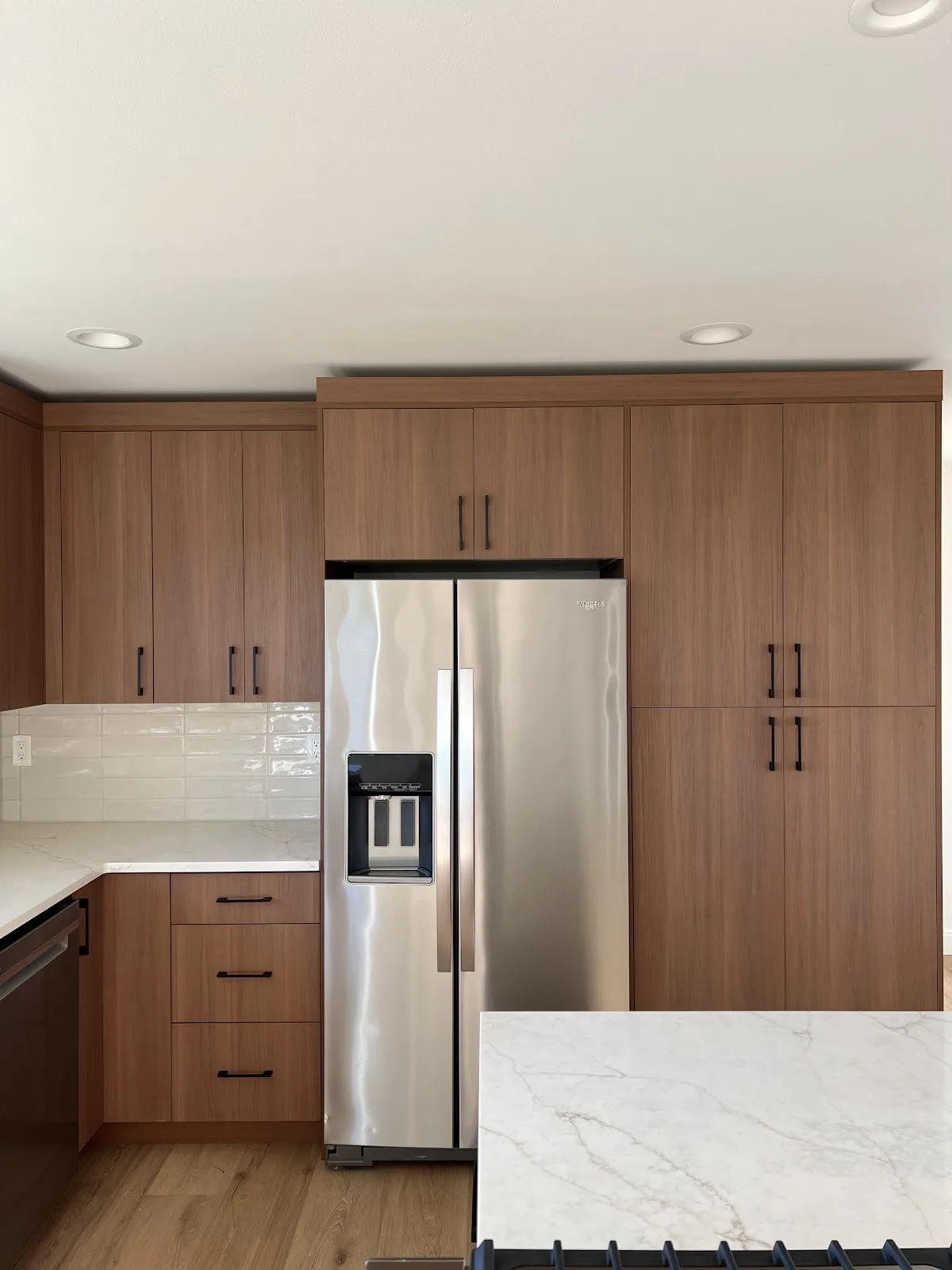 Bellingham rental kitchen, bath and laundry refresh with wood cabinetry and quartz counters in Bellingham, WA — Living By Design