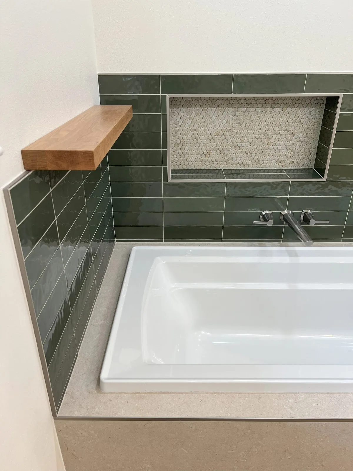 Bellingham bathroom with green and navy tile, wood vanity and freestanding tub in Bellingham, WA — Living By Design (4)