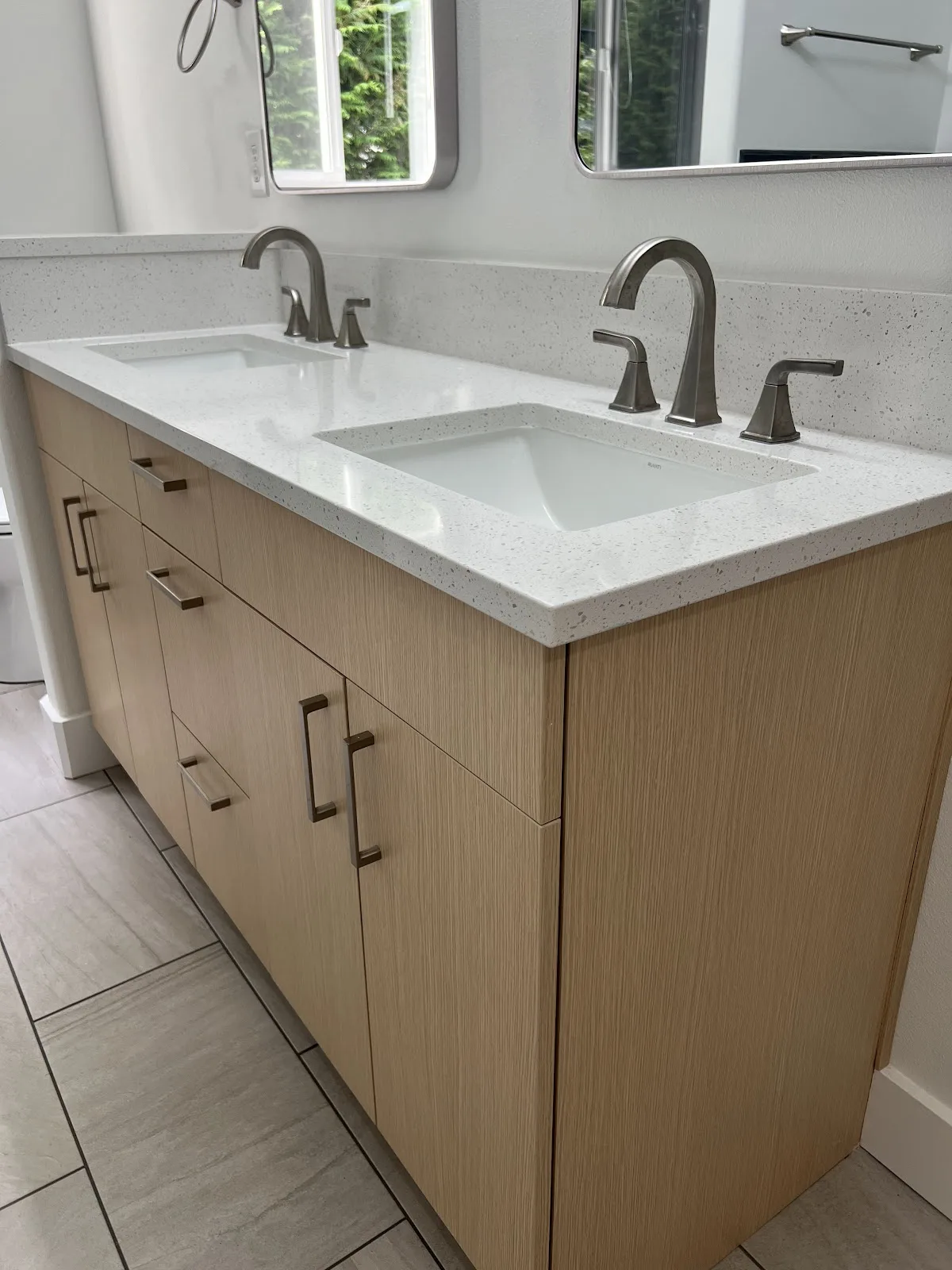 Bellingham bathroom with green and navy tile, wood vanity and freestanding tub in Bellingham, WA — Living By Design (6)