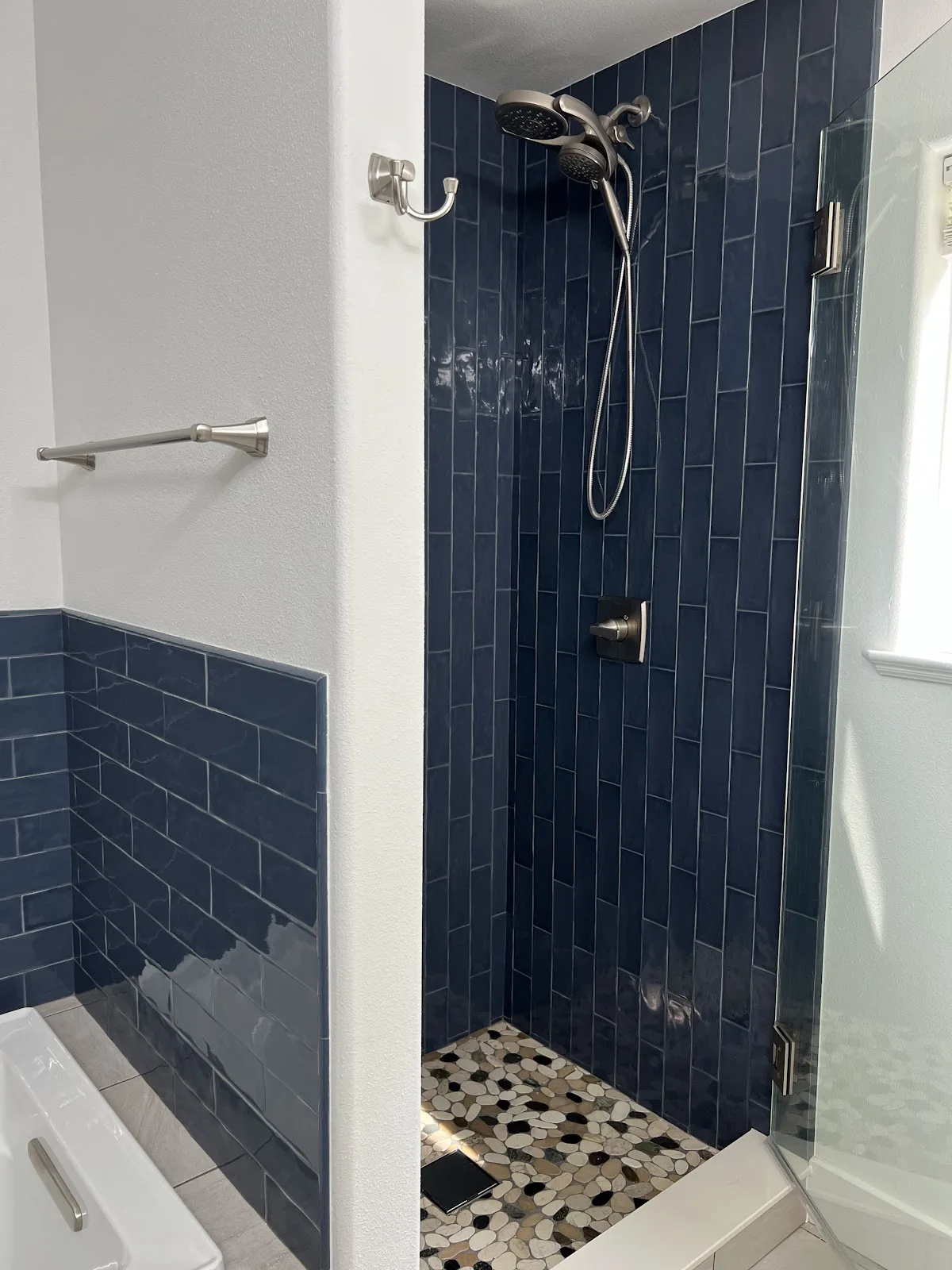 Bellingham bathroom with green and navy tile, wood vanity and freestanding tub in Bellingham, WA — Living By Design (9)