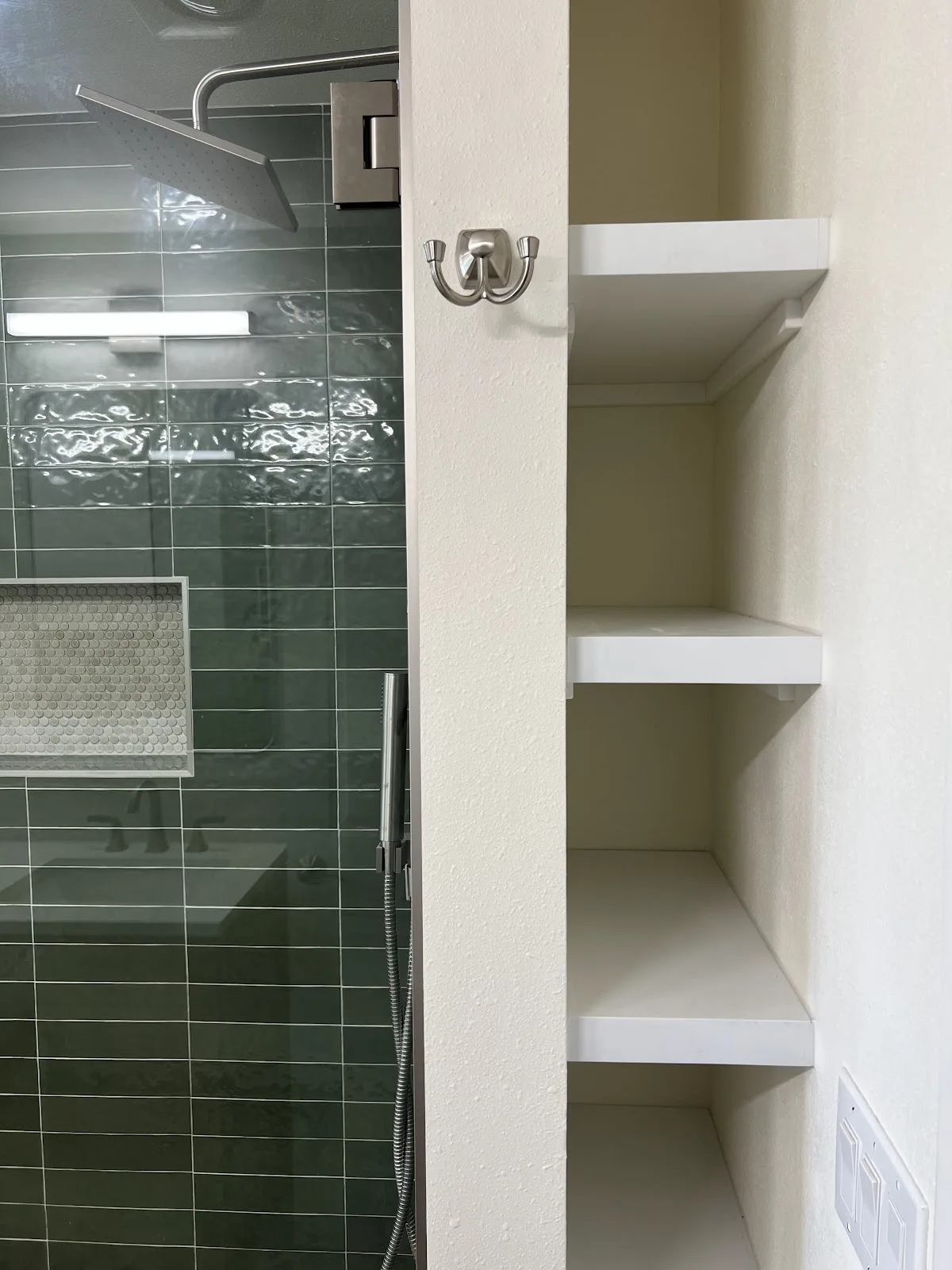 Bellingham bathroom with green and navy tile, wood vanity and freestanding tub in Bellingham, WA — Living By Design (10)