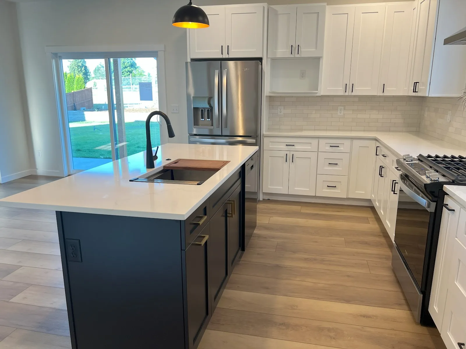 Everson new-build kitchen with navy island and quartz countertops in Everson, WA — Living By Design (6)