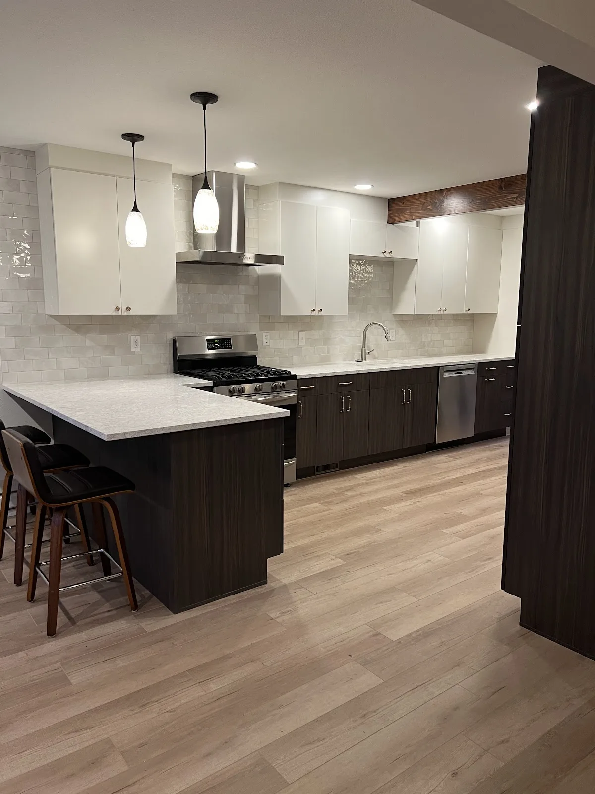 Ferndale kitchen with two-tone cabinetry, quartz counters and tile backsplash in Ferndale, WA — Living By Design