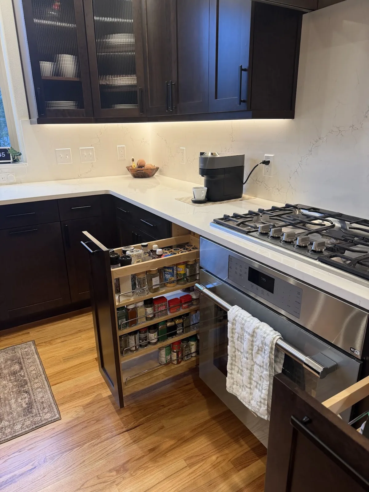 Cherry kitchen with quartz island and hardwood floors in Bellingham, WA — Living By Design (4)