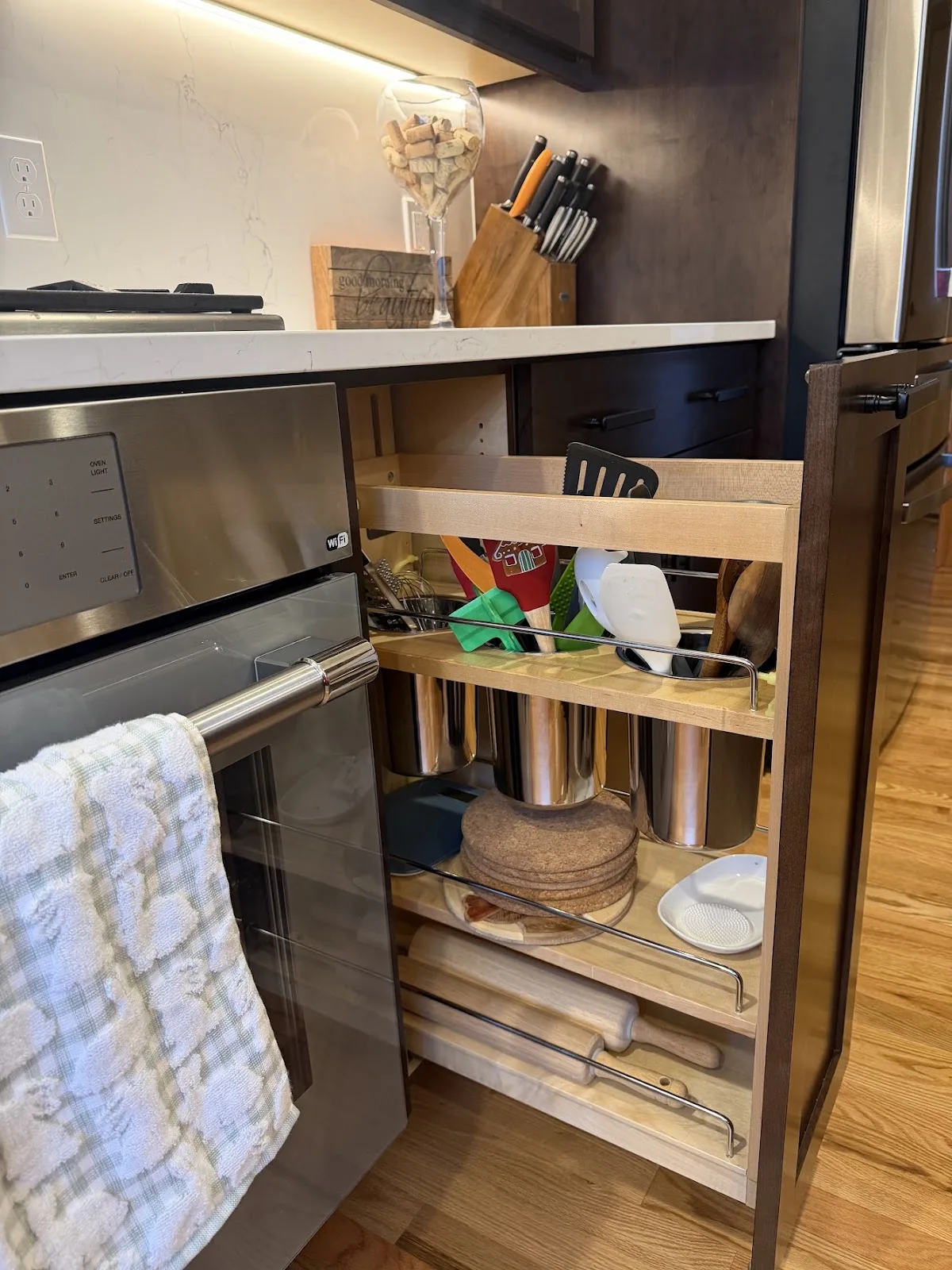 Cherry kitchen with quartz island and hardwood floors in Bellingham, WA — Living By Design (5)