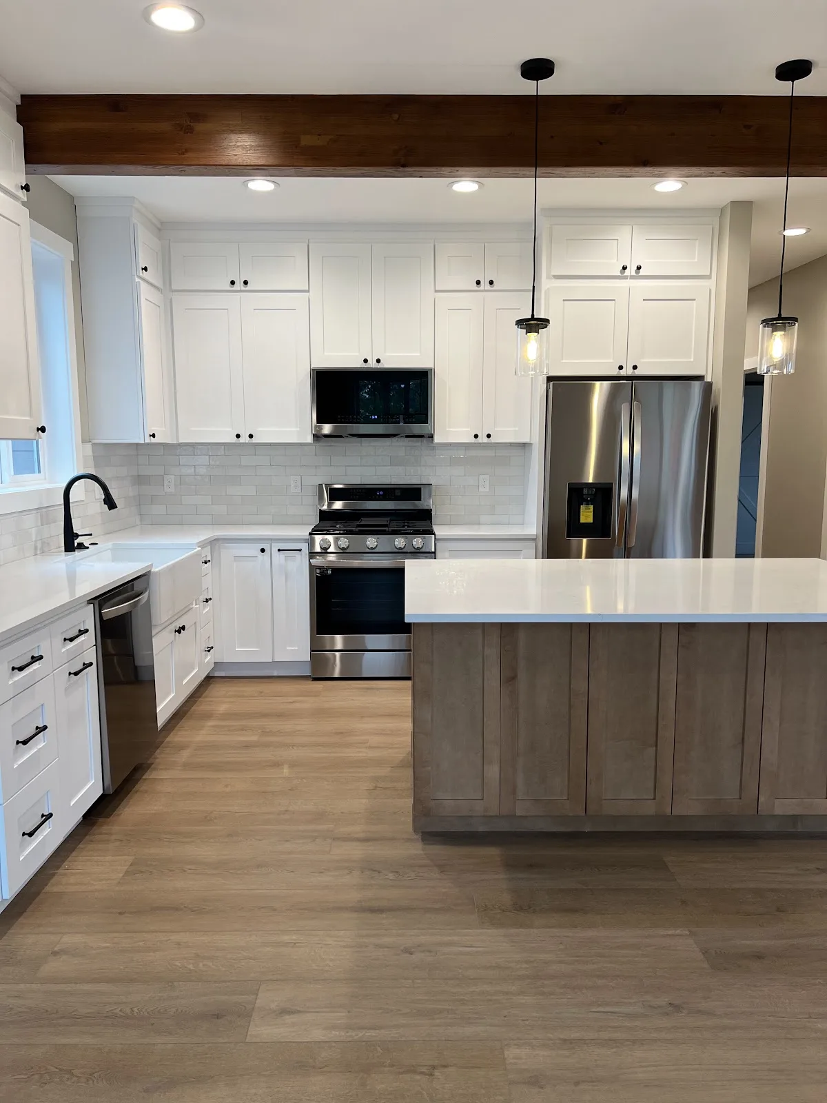 Lynden new-build kitchen with white shaker cabinetry and wood island in Lynden, WA — Living By Design (2)