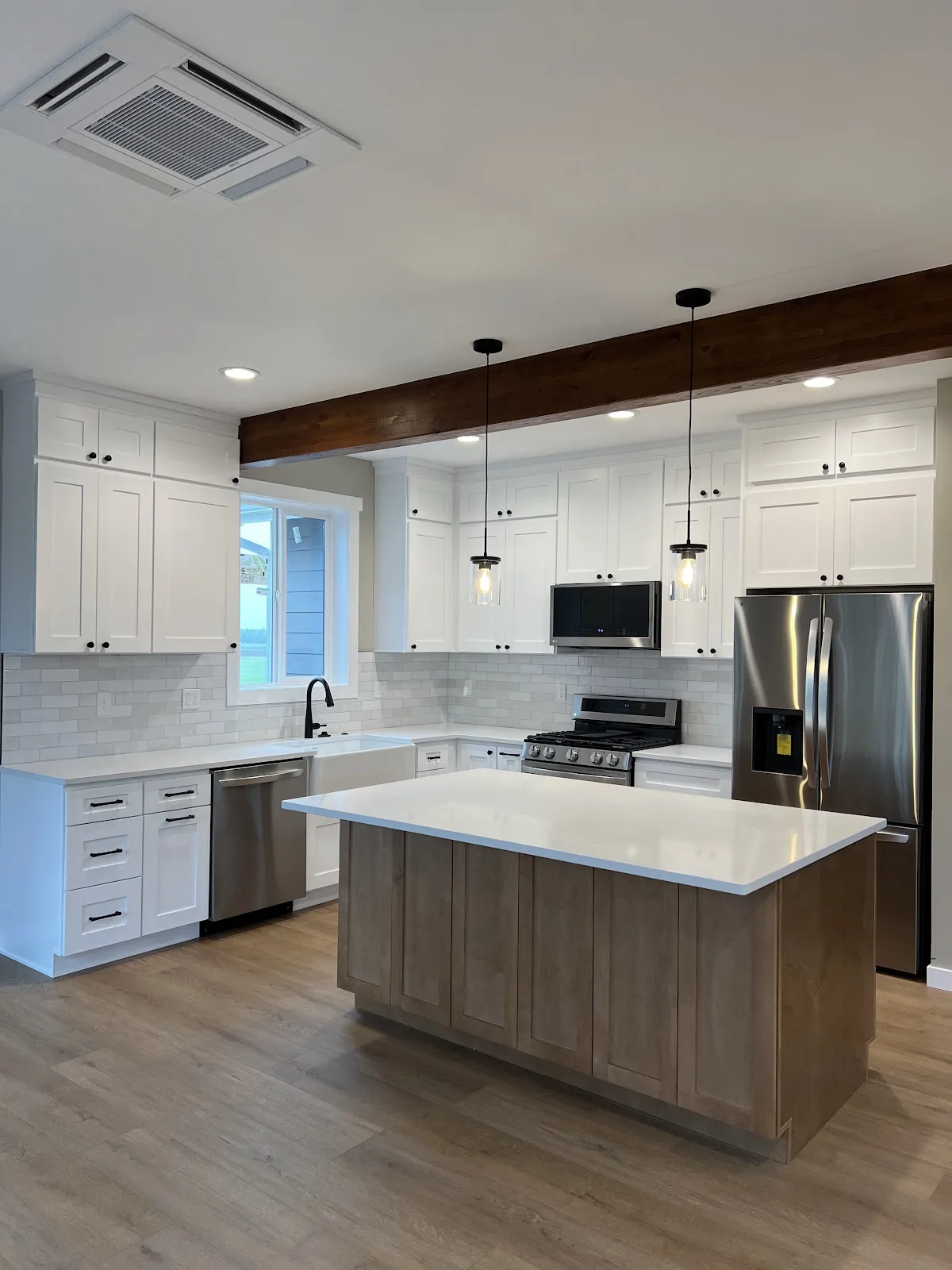 Lynden new-build kitchen with white shaker cabinetry and wood island in Lynden, WA — Living By Design (3)