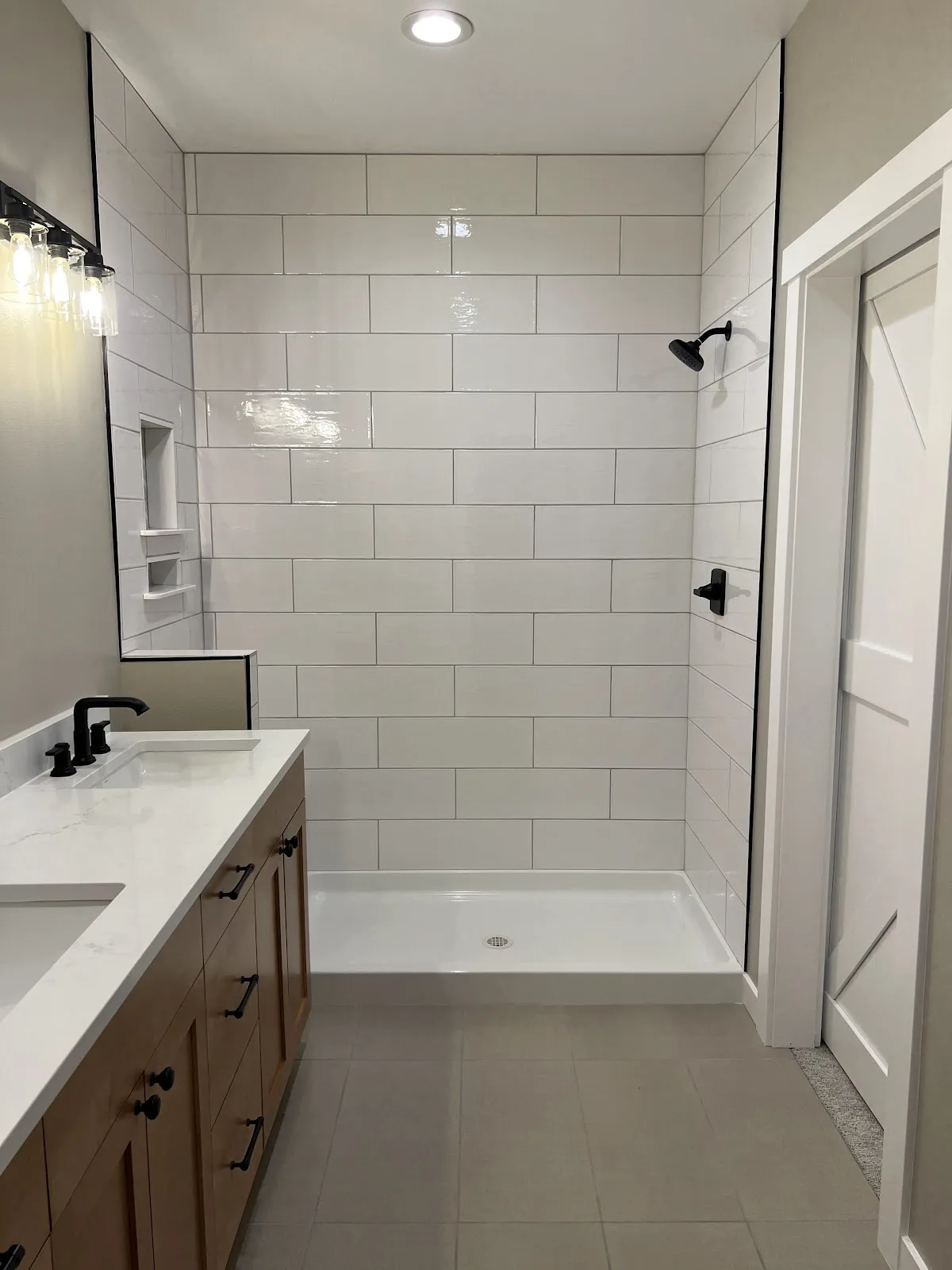Lynden new-build kitchen with white shaker cabinetry and wood island in Lynden, WA — Living By Design (5)