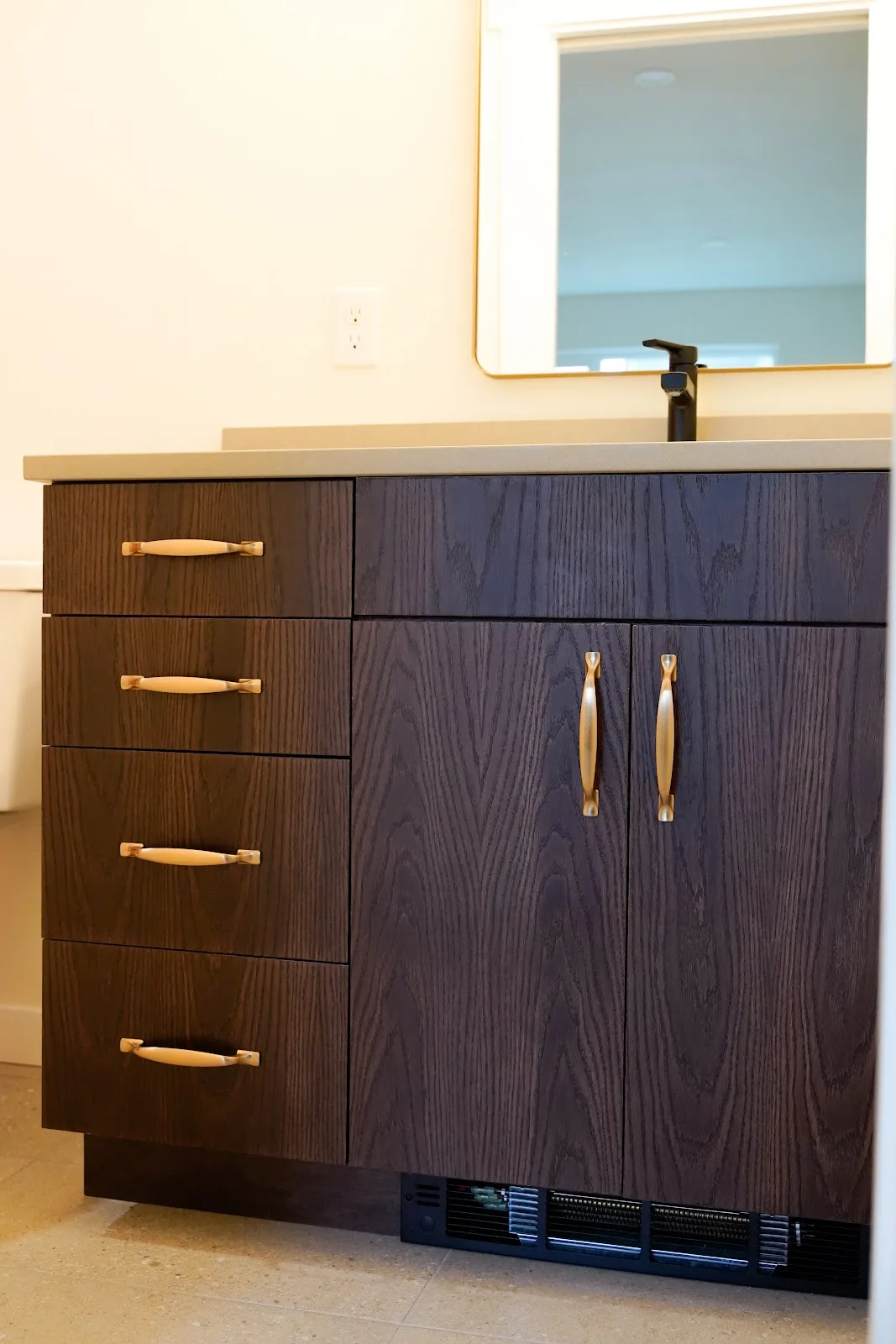 Kitchen and bath remodel with stained cabinetry, quartz island and a tiled fireplace wall in Bellingham, WA — Living By Design (6)