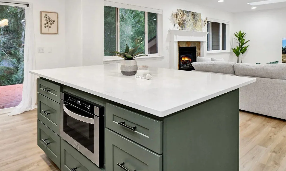 Sudden Valley kitchen with sage-green cabinetry and quartz island in Bellingham, WA — Living By Design (3)