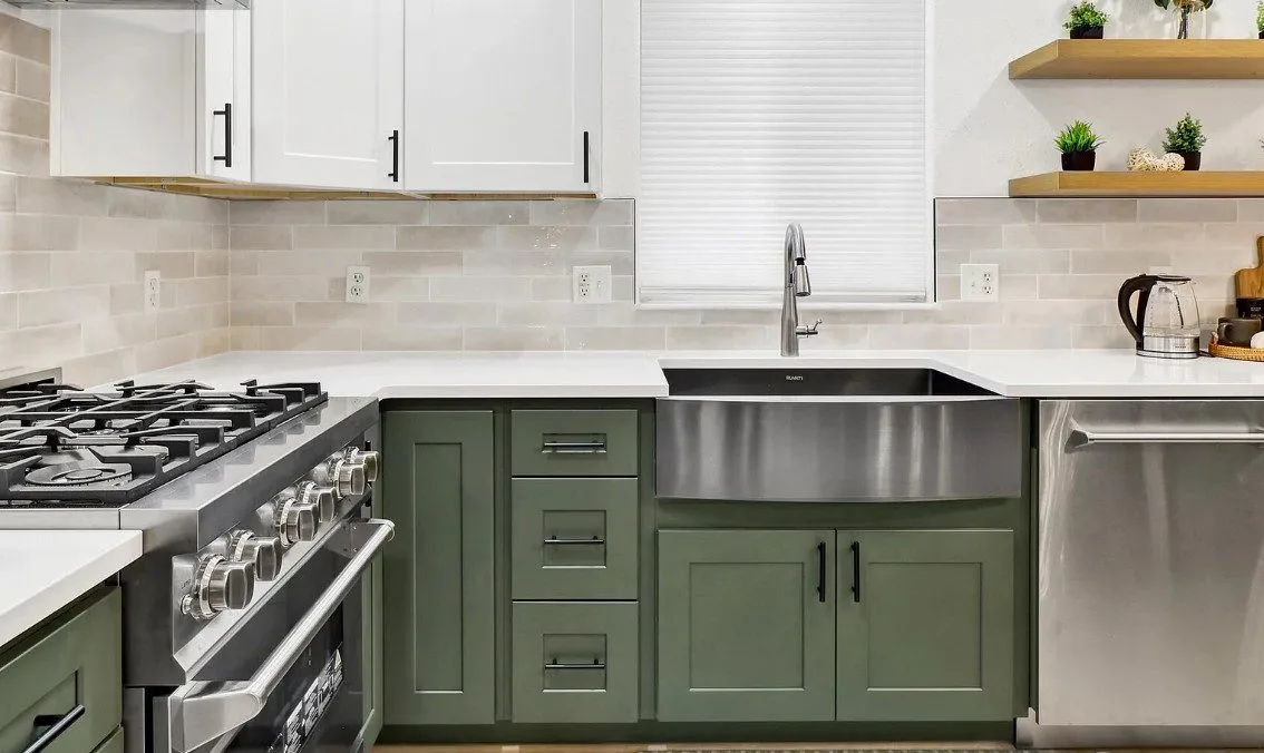 Sudden Valley kitchen with sage-green cabinetry and quartz island in Bellingham, WA — Living By Design (5)